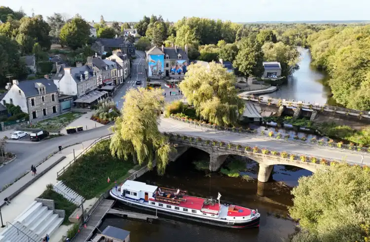 An aerial view of a classic hotel barge moored in Brittany France.